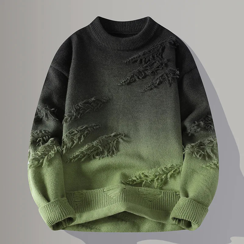 Green and black sweater with distressed details on a gray background