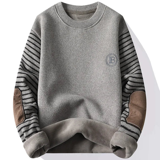 Gray sweater with patterned sleeves on a white background