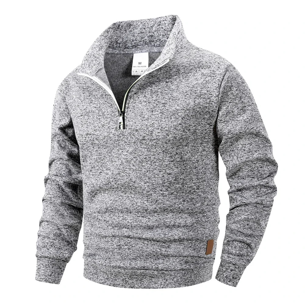 Gray sweater with a quarter zip on a white background