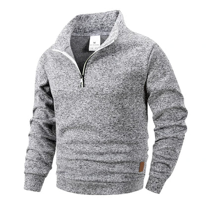 Gray sweater with a quarter zip on a white background