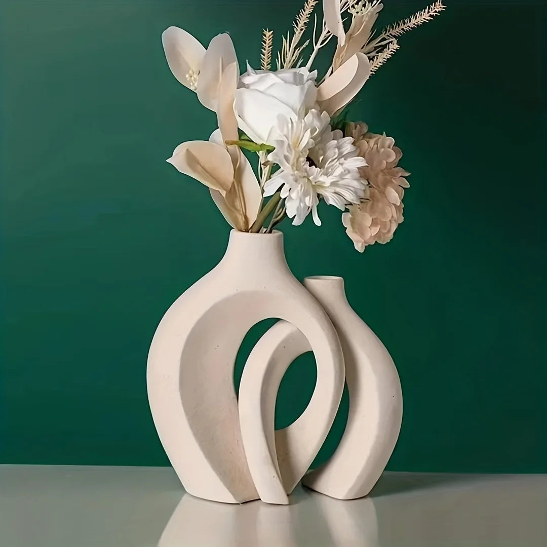 Decorative vase with floral arrangement on a green background