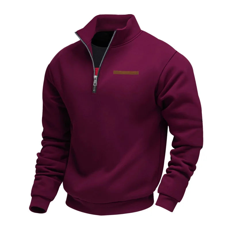 Maroon pullover with a small logo on a white background