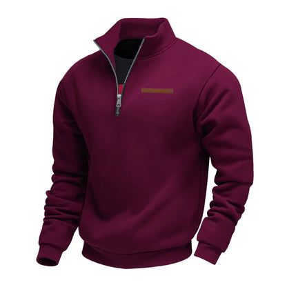 Maroon pullover with a small logo on a white background