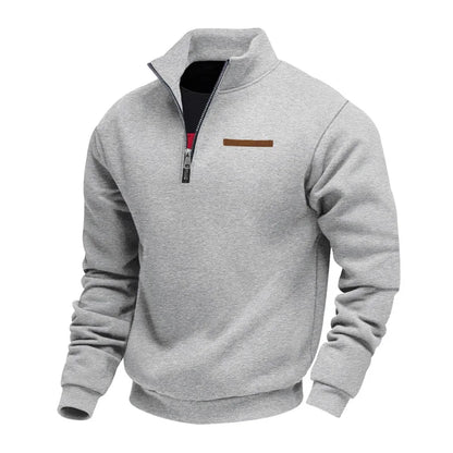 Gray pullover with a quarter zip on a white background