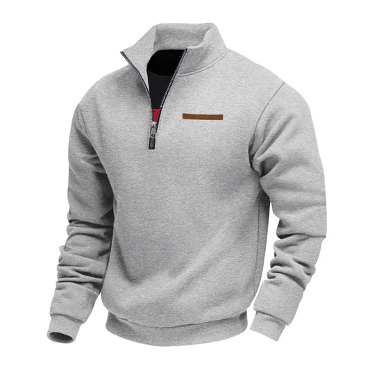 Gray pullover with a quarter zip on a white background