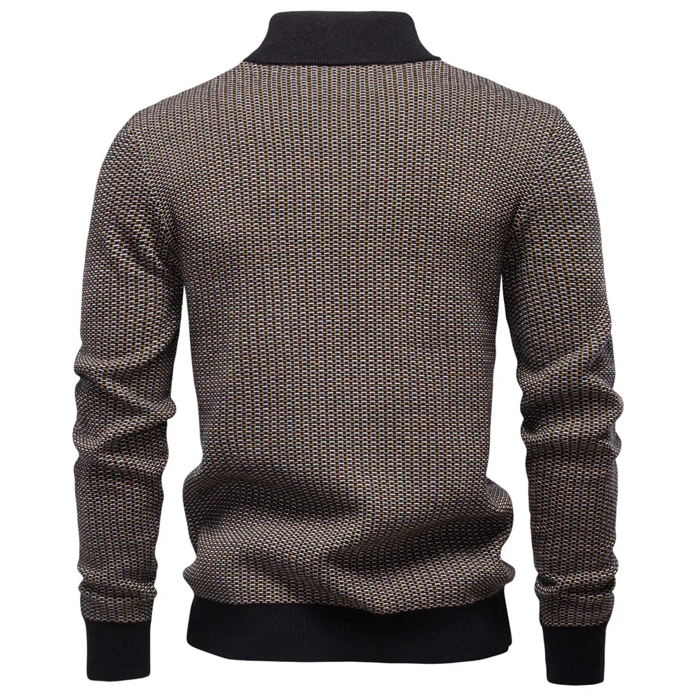 Brown patterned sweater with black ribbed trim on a white background