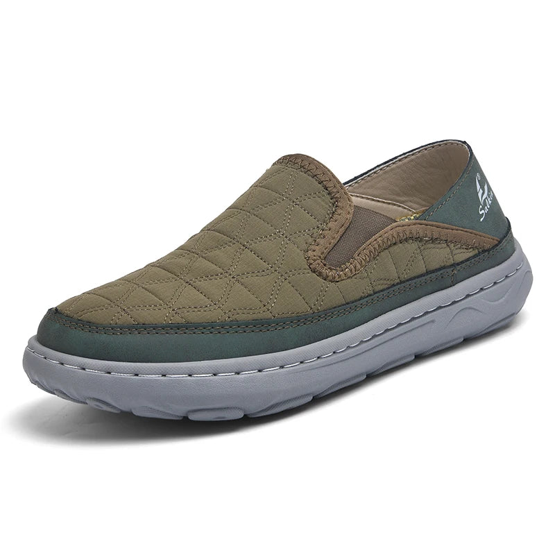 Green slip-on shoe with quilted design on a white background