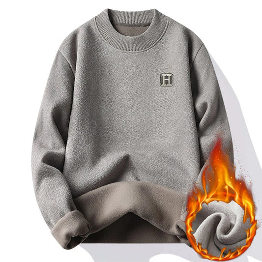 Gray sweatshirt with a logo on a white background, showing flames at the bottom right corner.