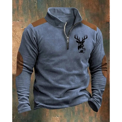 Gray long-sleeve shirt with brown sleeves and deer head design on a rustic wooden background