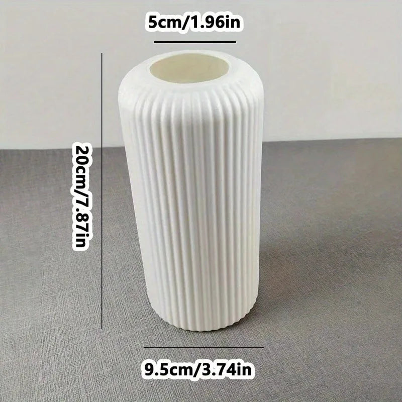 White textured cylindrical object with measurements on a gray surface