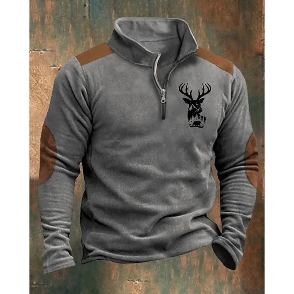 Gray pullover with brown accents and a deer emblem on a rustic wooden background